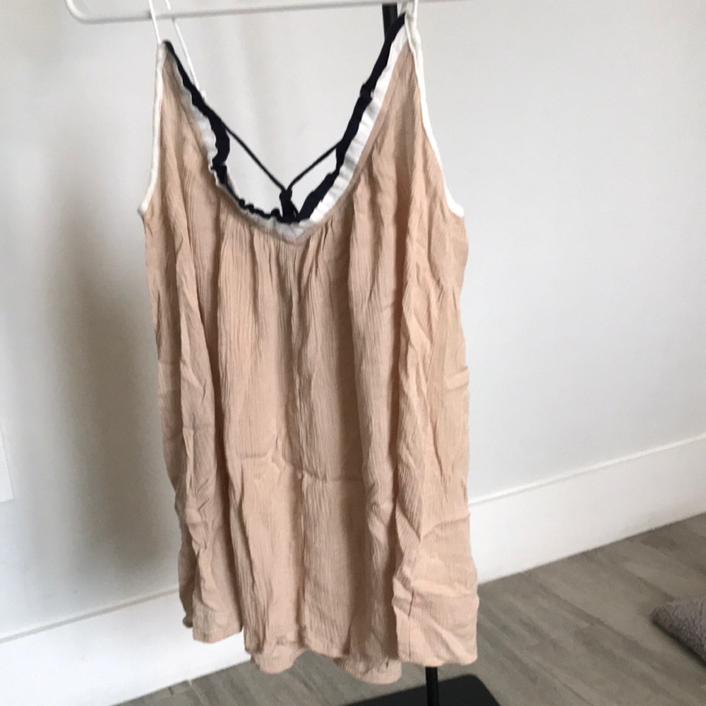Beige, navy and white flowy shirt with Poms. Never worn, perfect condition.